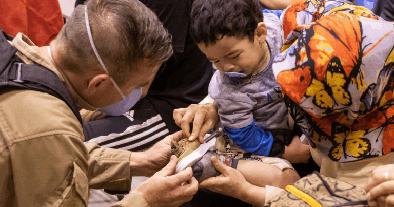 Emergency Worker Helping Child