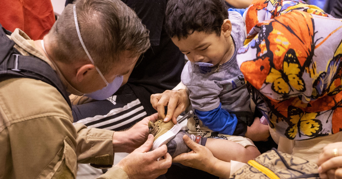 Emergency Worker Helping Child